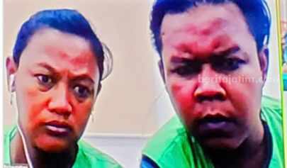 Aris Susanti (kiri) saat menjalani sidang.